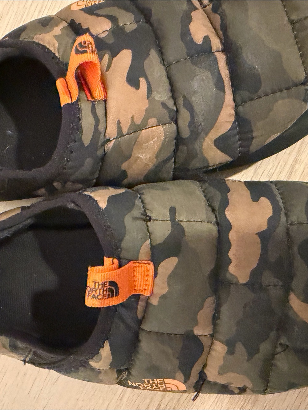 The North Face Kids Camouflage Puff Slippers in Olive, Black & Orange